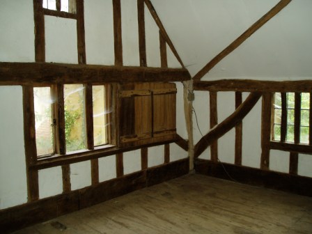 The main bedroom before work started, showing three of the four mullion windows