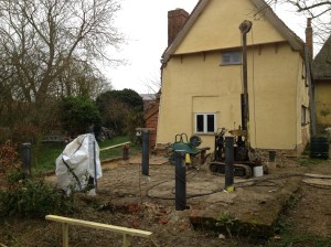 Pile driver and steel piles, before they were filled with concrete and trimmed back.