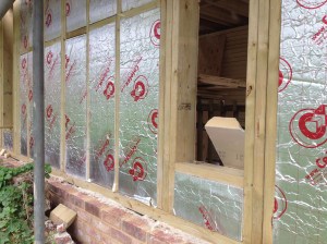The panels are infilled with insulation, with plywood panelling behind