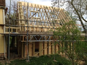 The roof timbers are added, with a Glulam central beam