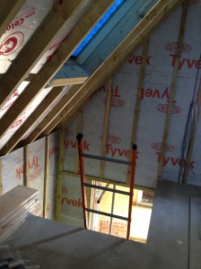 Staircase opening on the first floor showing Celotex between studs