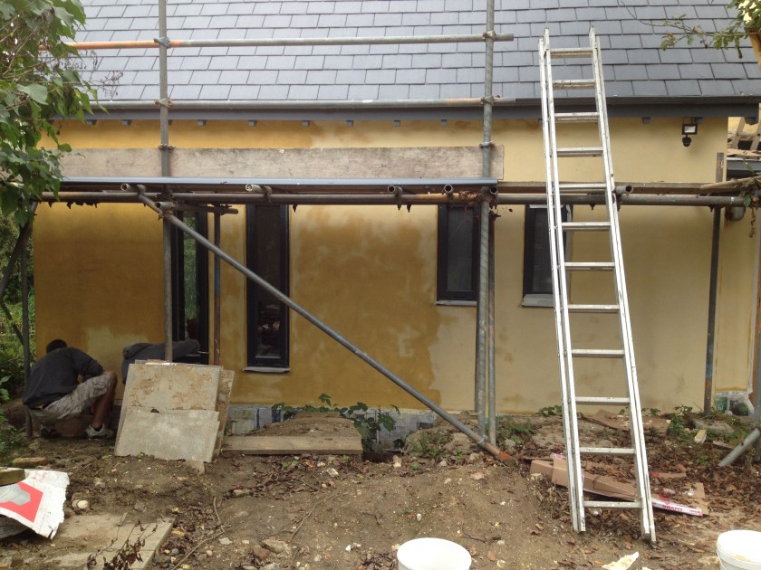 Brushing on Ingleby's 3-coat tallow limewash